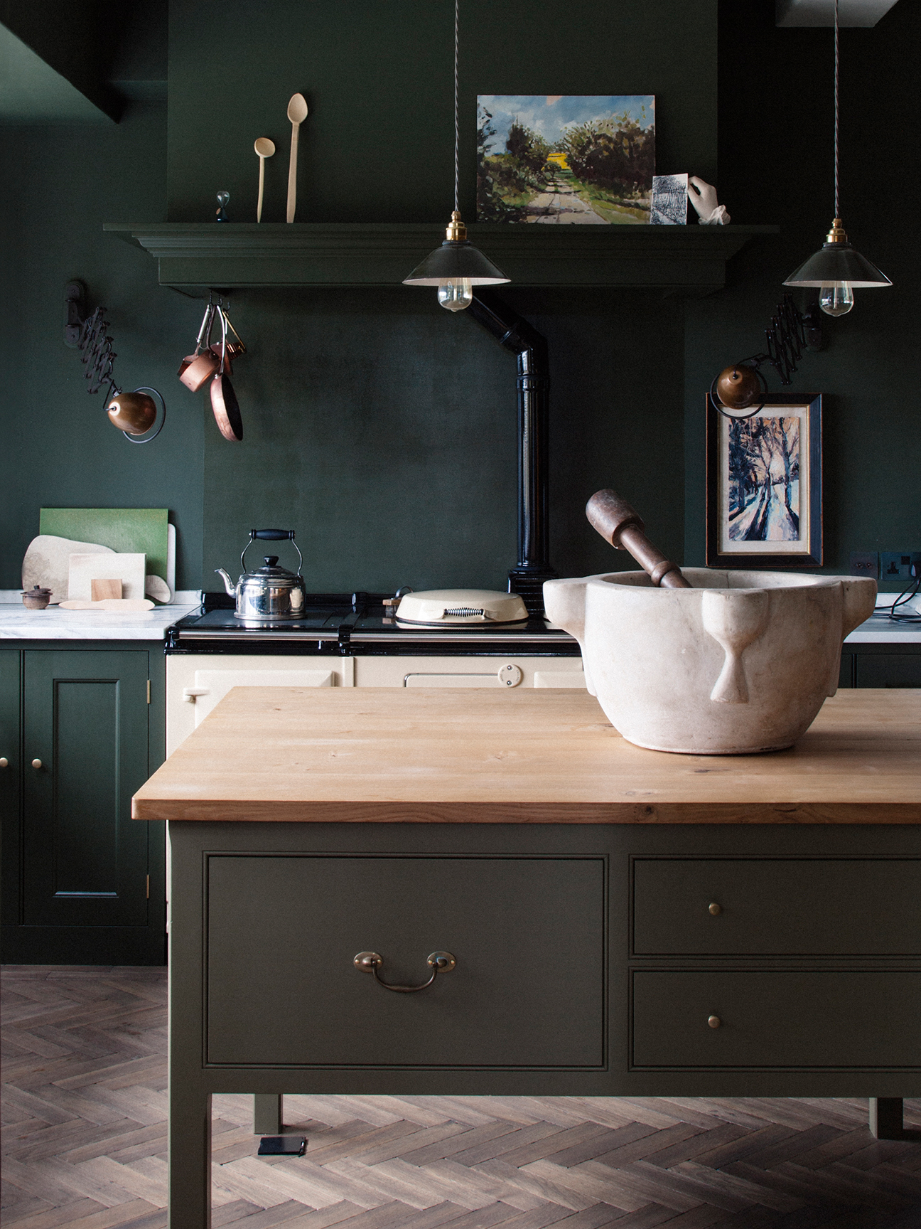 dark green farmhouse kitchen wiht butcher block island