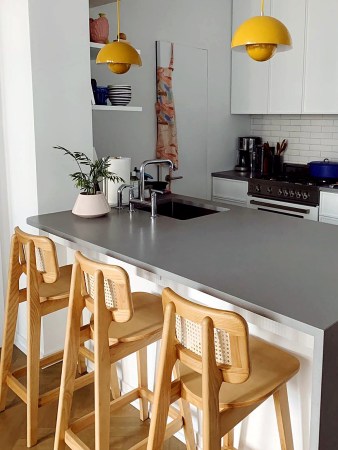 kitchen with yellow pendant lights