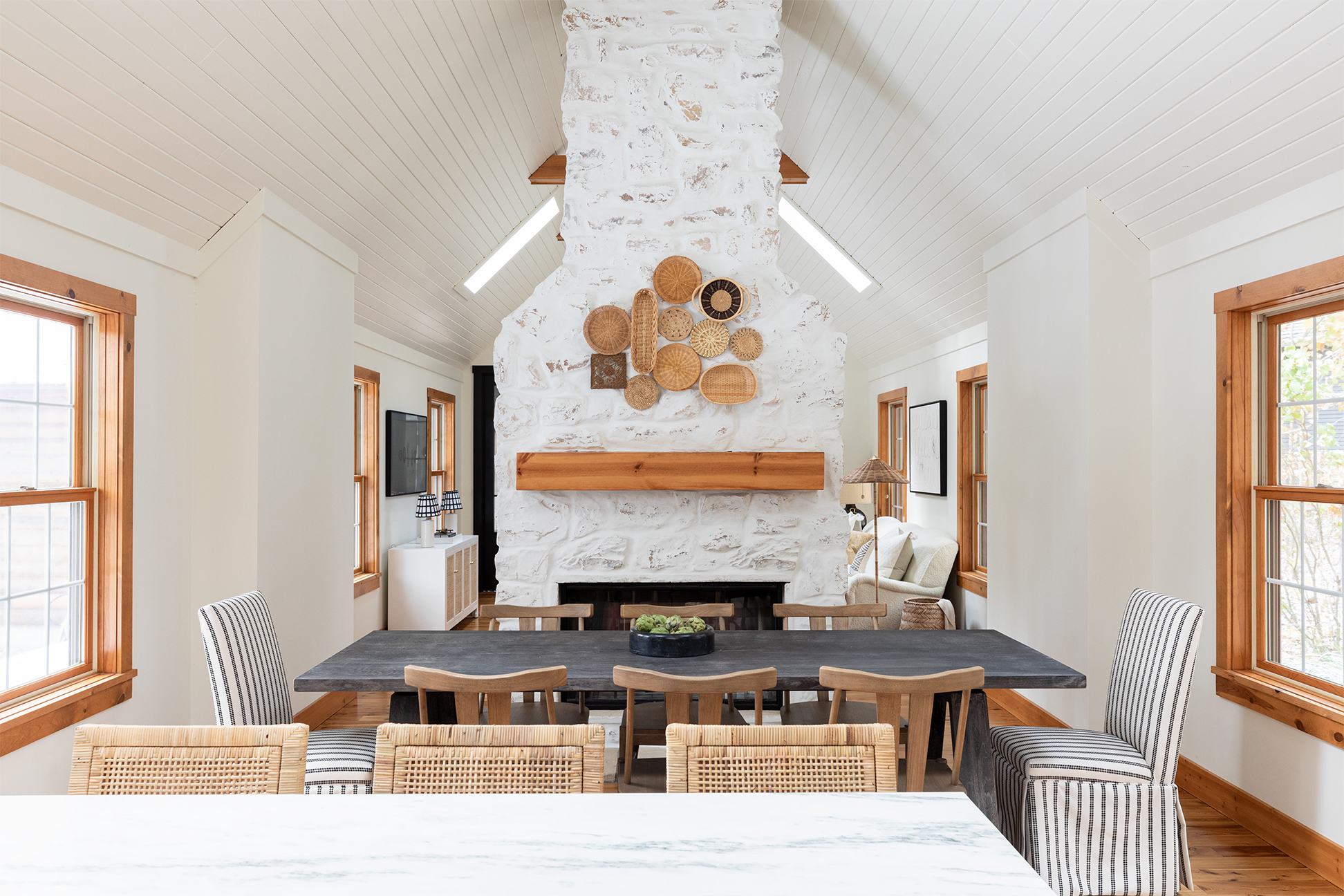 dining room with baskets adhered to fireplace