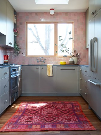 Custom Knobs and a Hit of Shine Turn a Ho-Hum Kitchen Into a Stunner