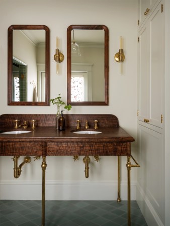 bathroom sink with dark wood