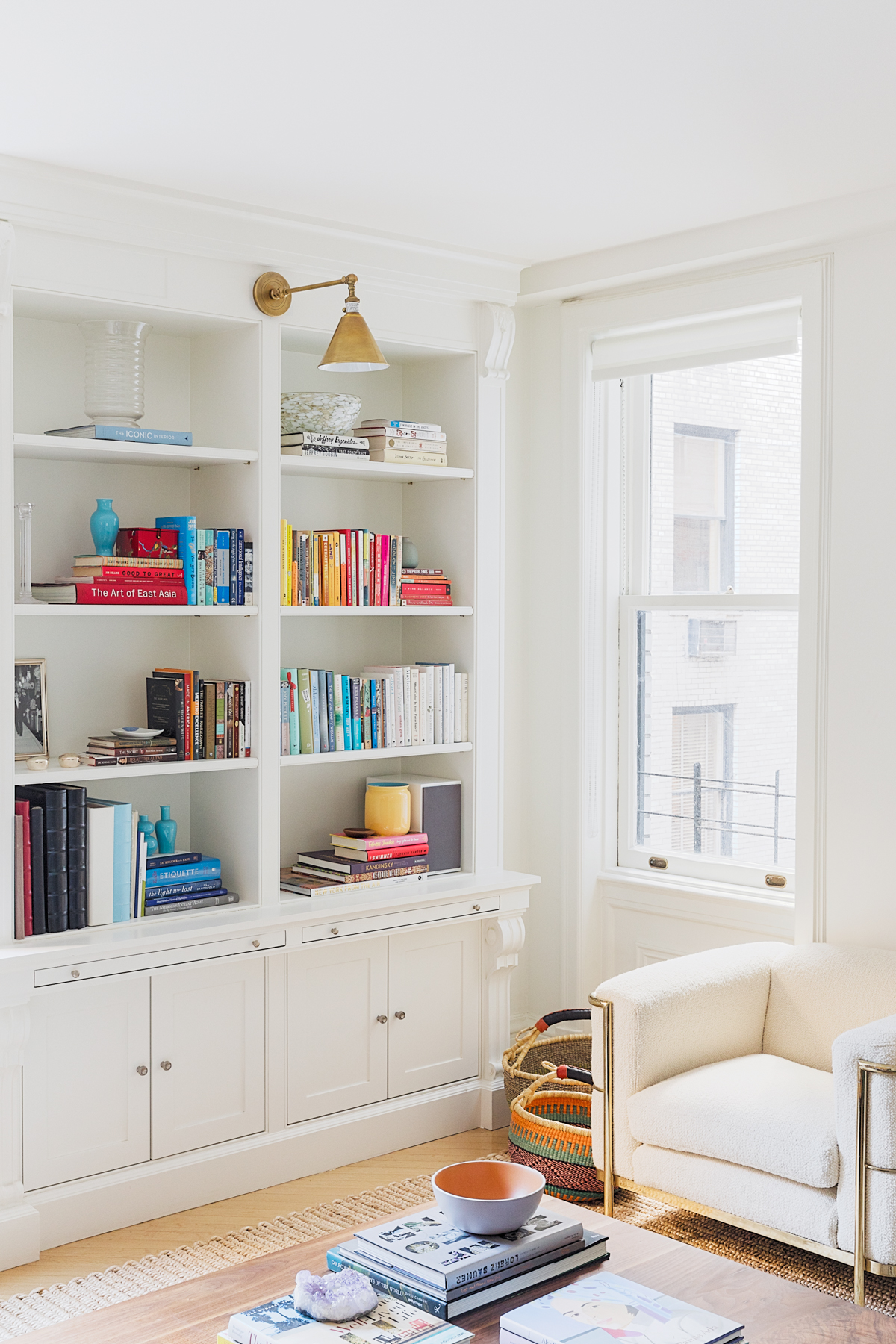 White apartment with bookshelves