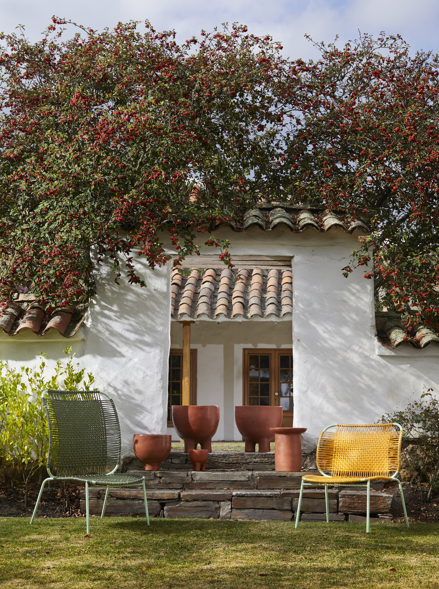 exterior of home with two woven chairs