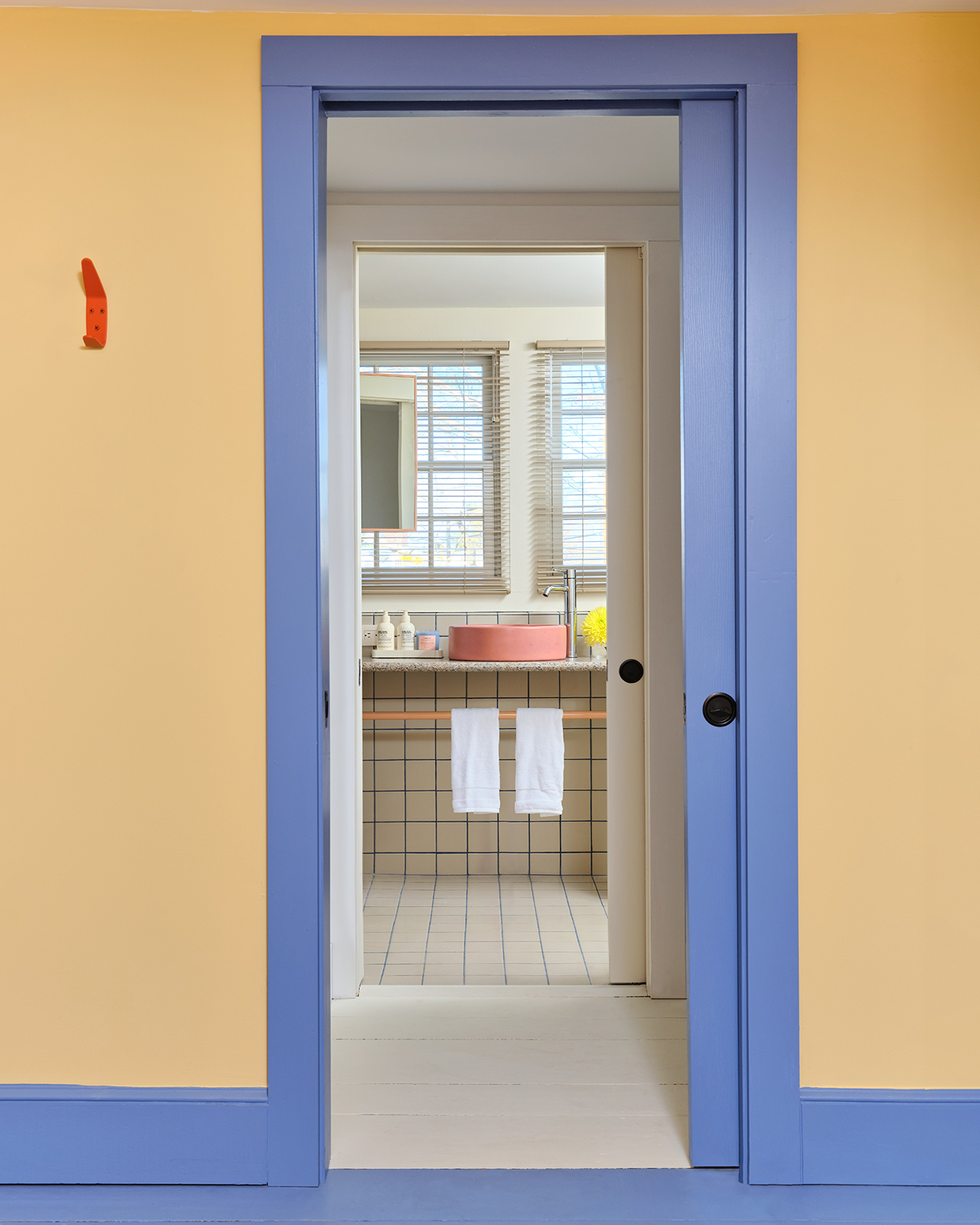 purple door frame and yellow walls