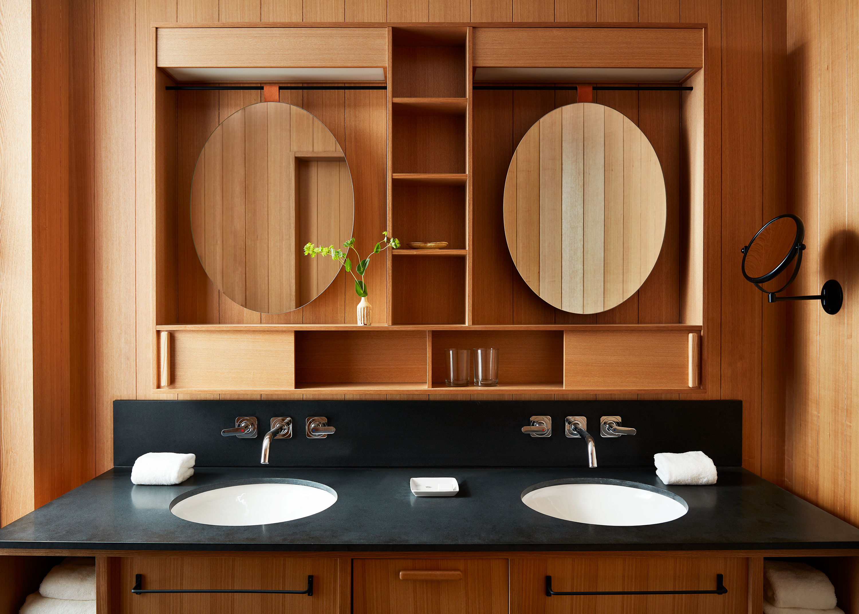 double vanity in wood panel bathroom