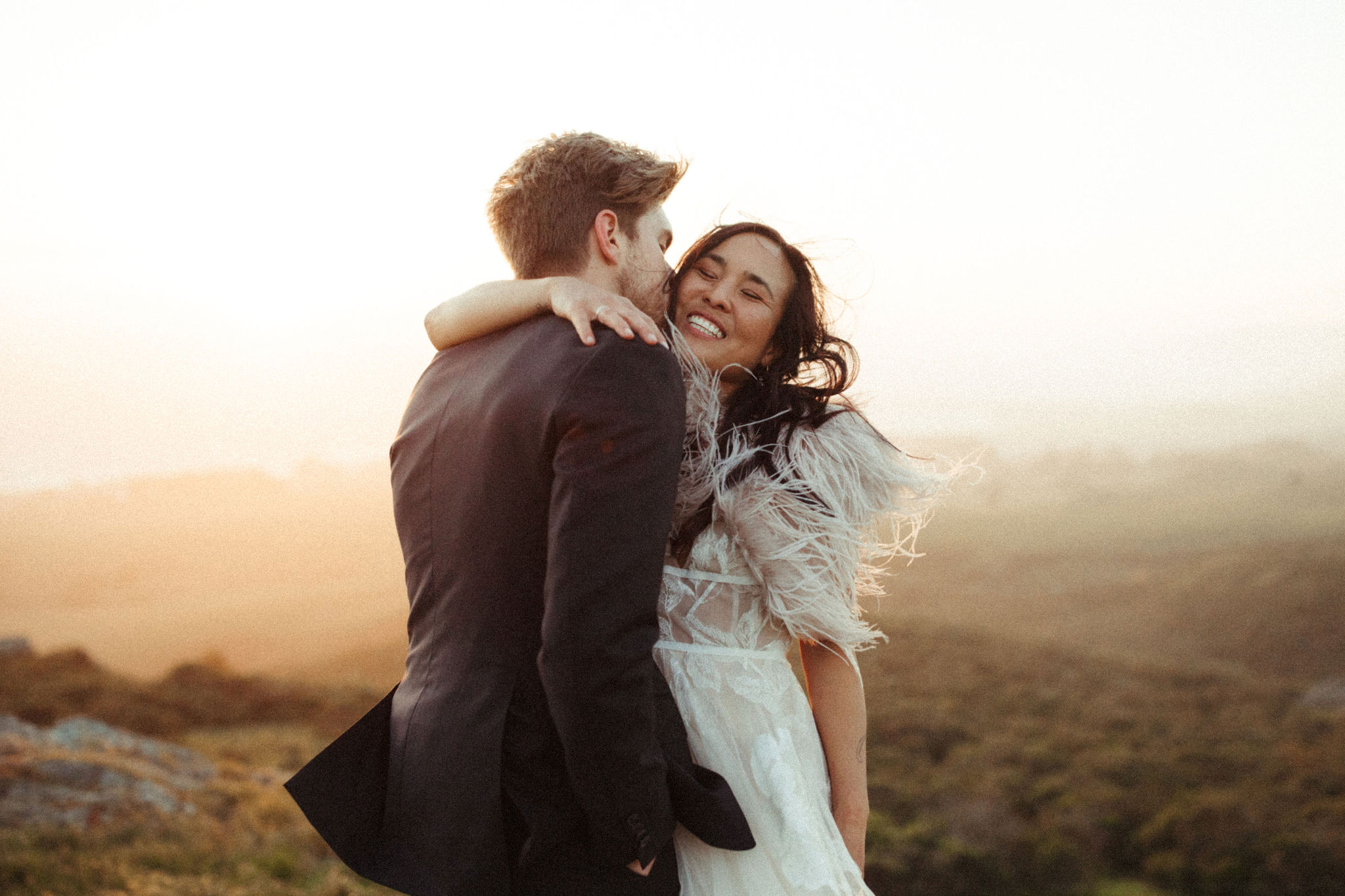 couple hugging at sunset