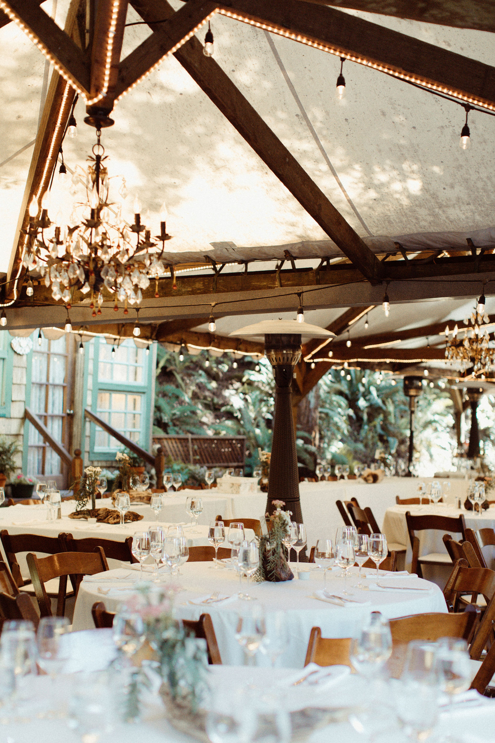 tent with white linen tables