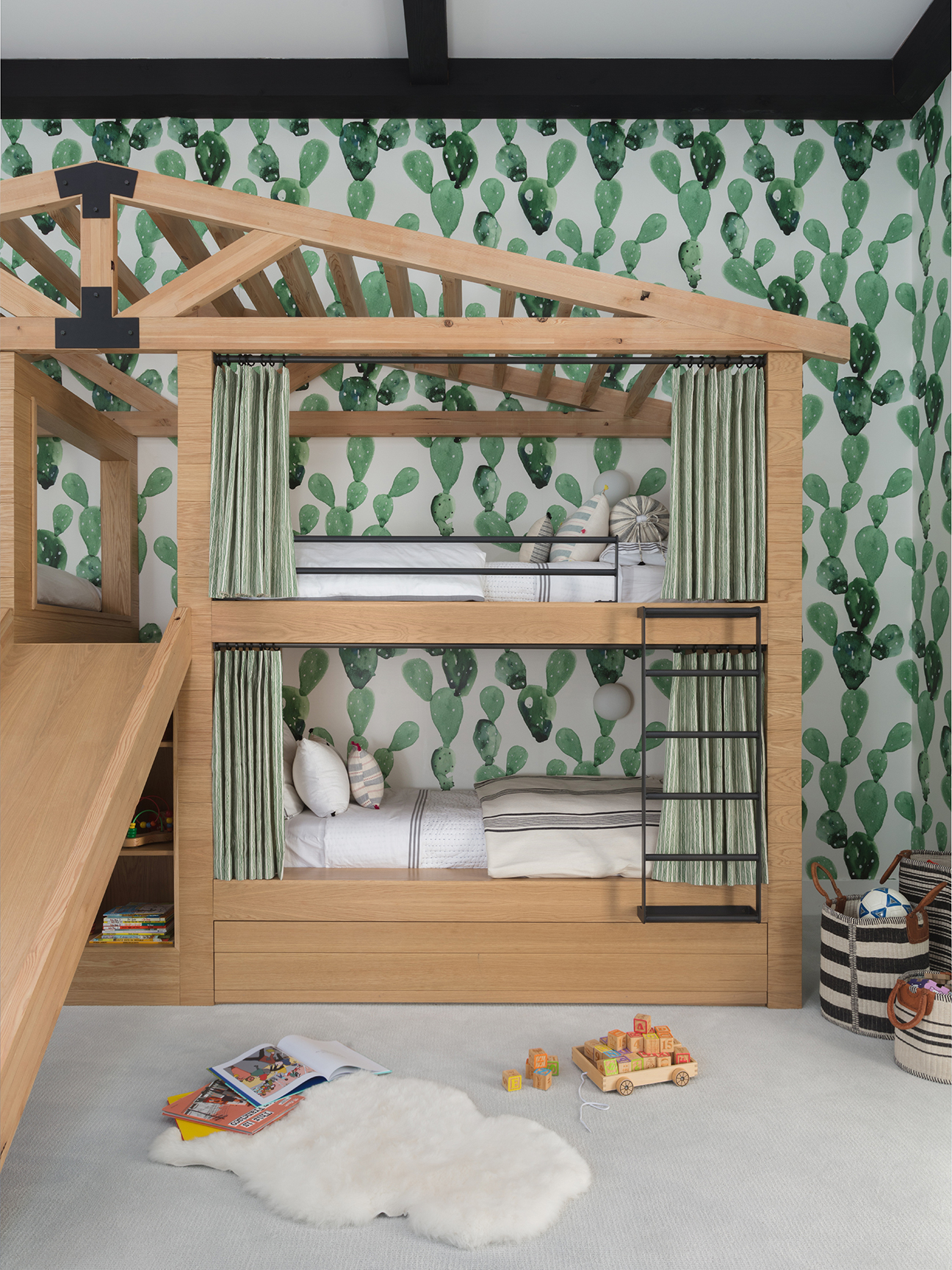 house-shaped bunkbed with cactus wallpaper