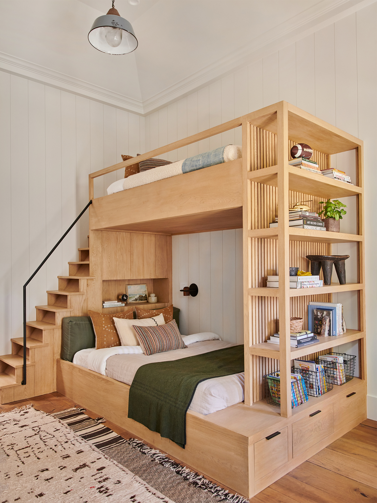wooden bunk bed with bookshelf and stairs