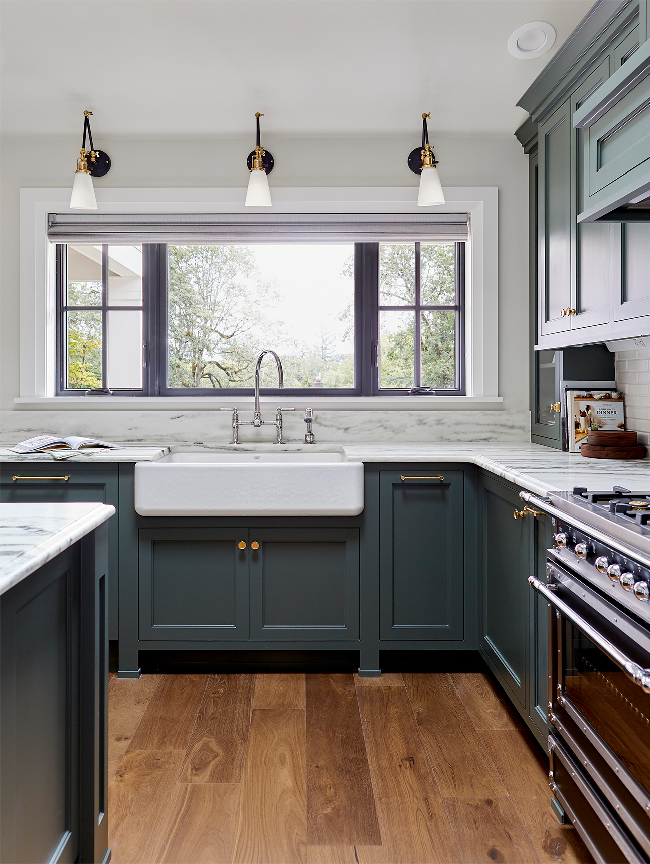 dark green kitchen with farmouse sink