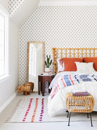 light and airy bedroom with patterned wallpaper