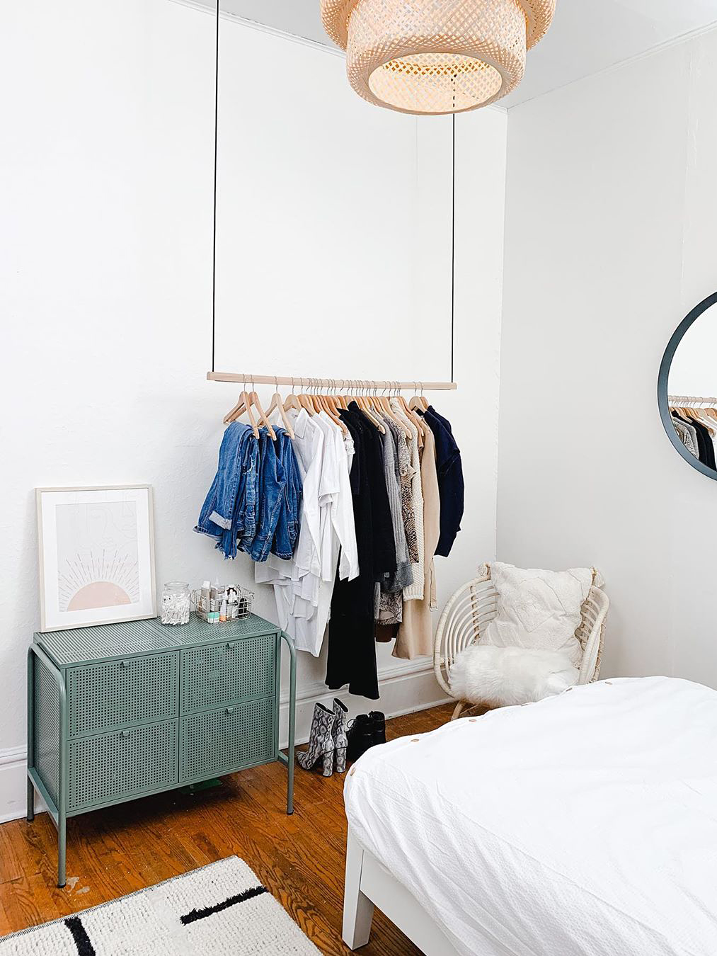 hanging clothering rack and green dresser