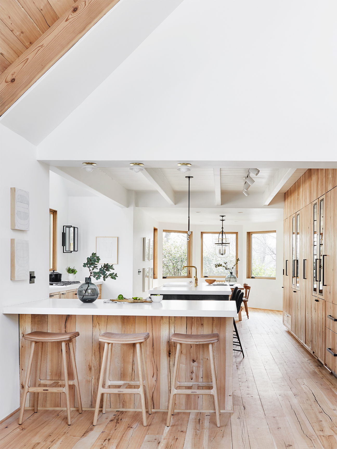 white kitchen with raw wood cabinetry