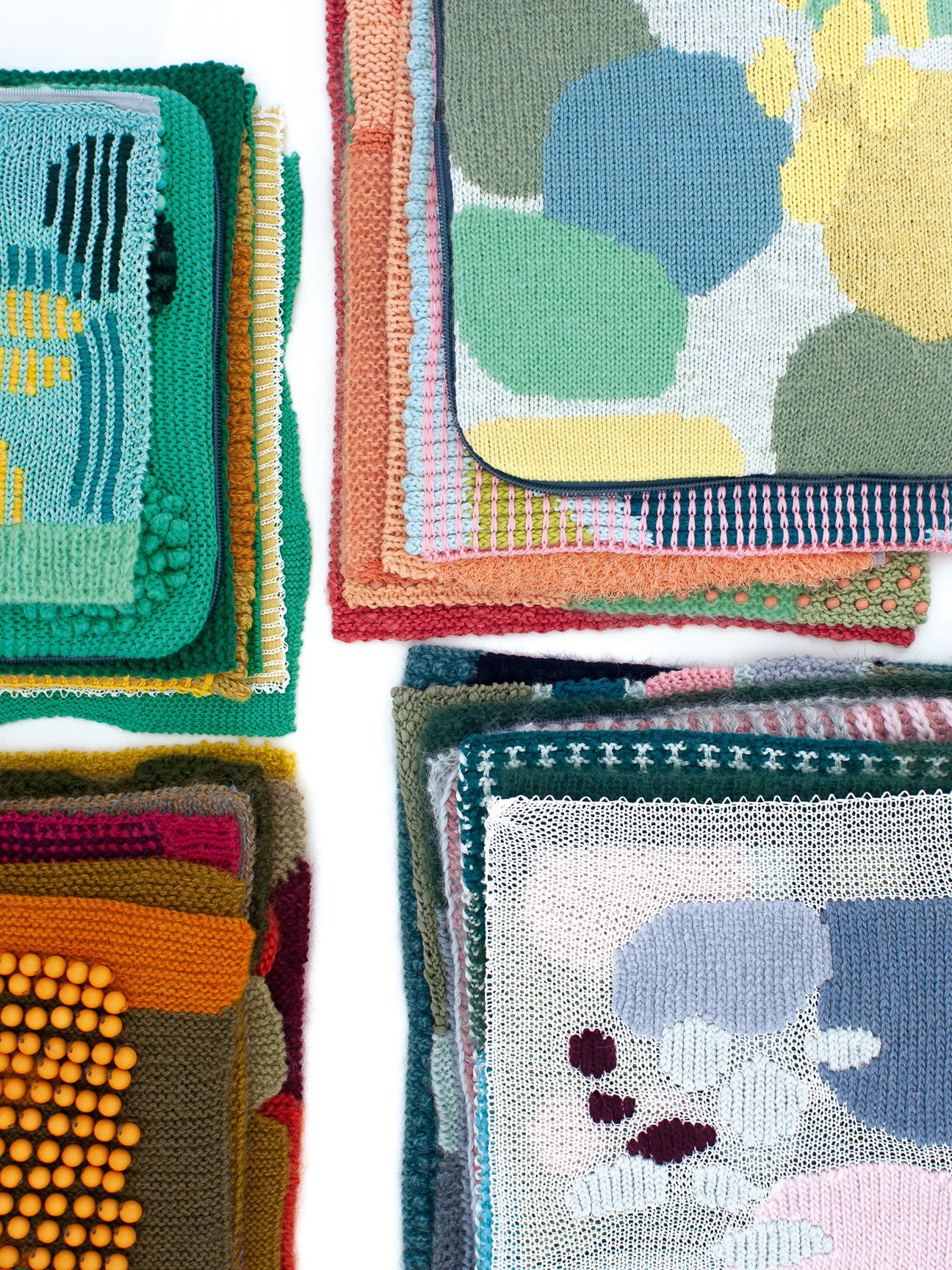 Colorful mixed knitted samples in varied patterns
