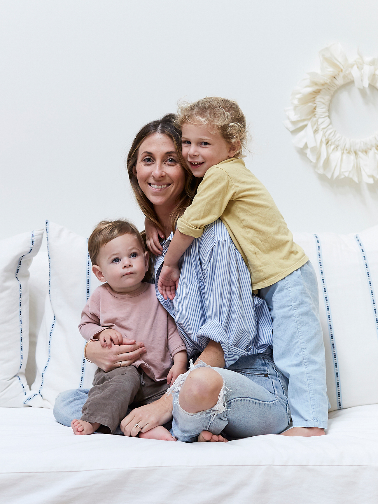 mom with two kids hugging