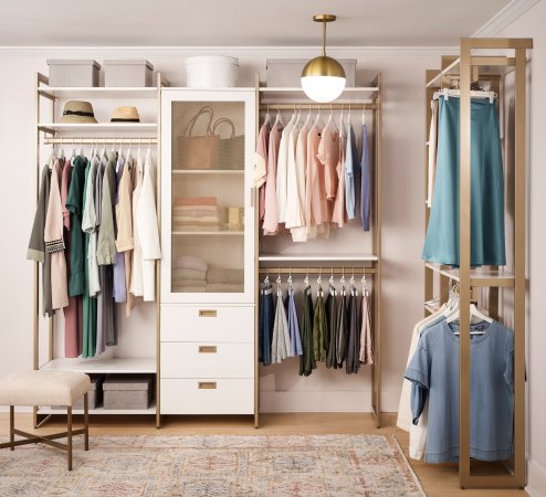 white and brass closet unit