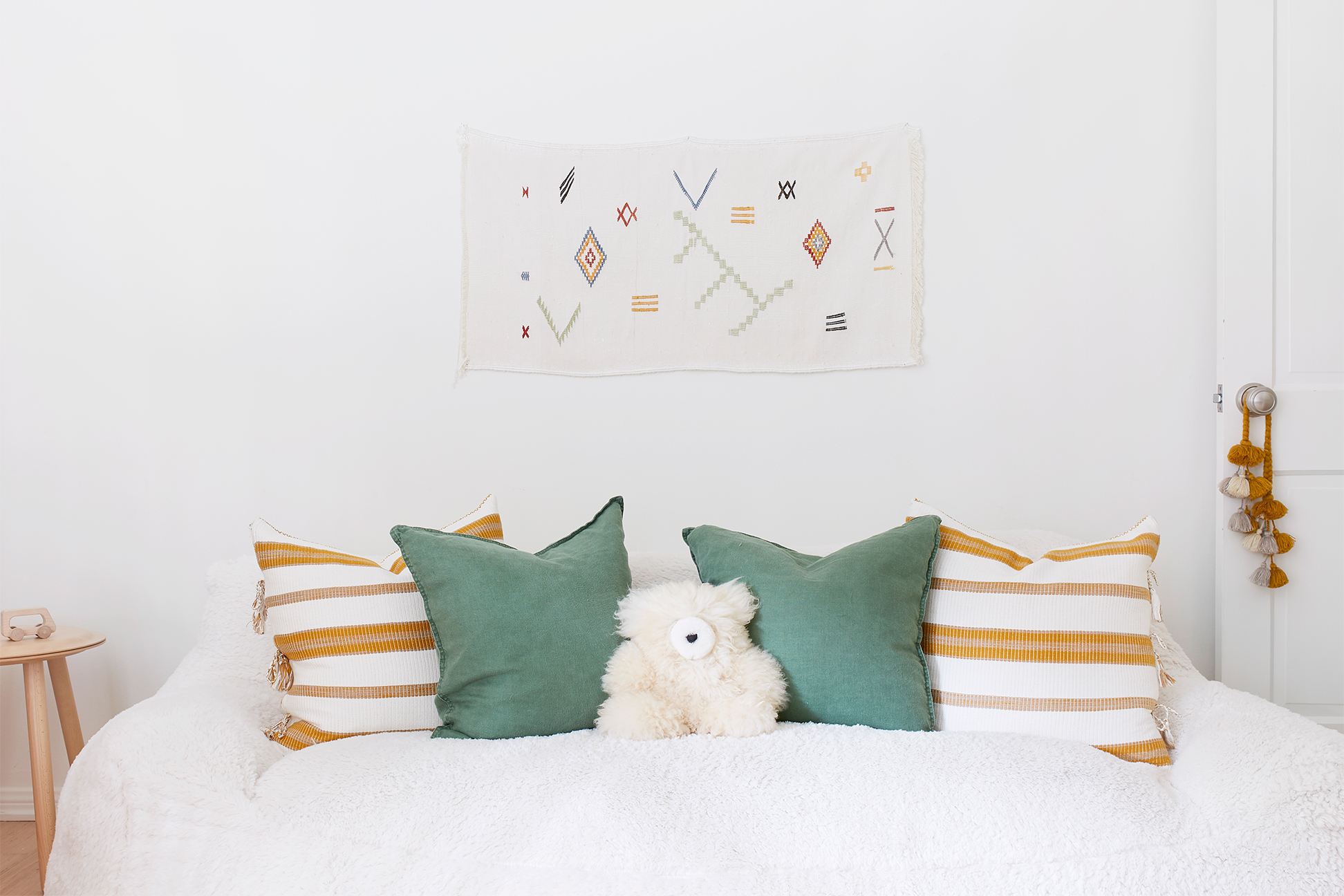 cozy white sofa with striped pillows