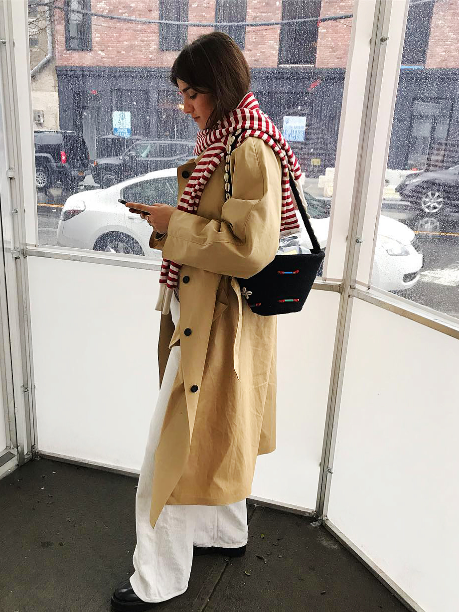 girl in trench coat and red scarf