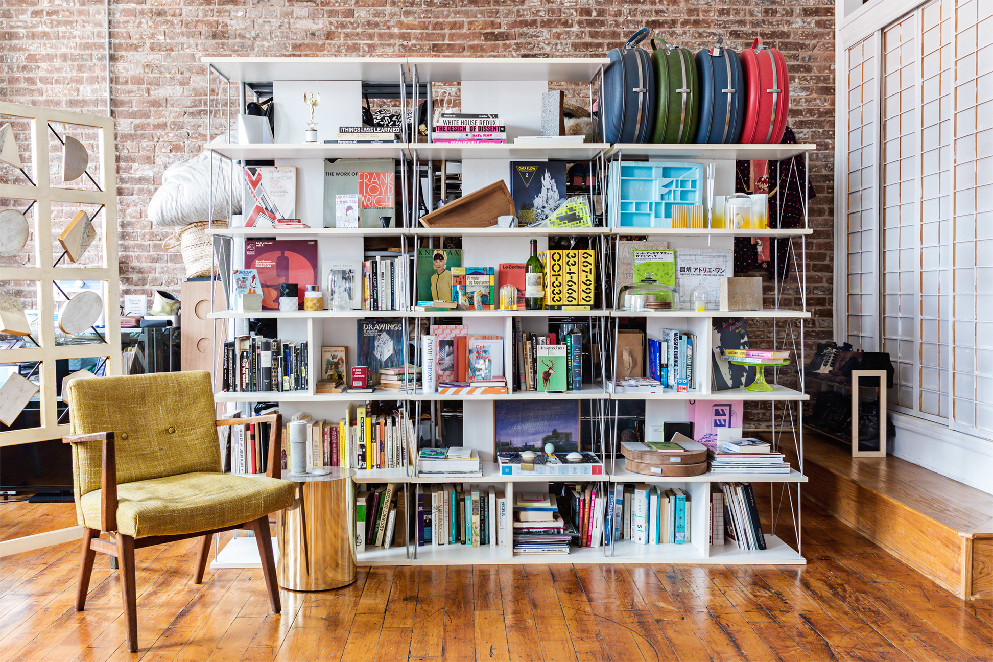 studio with large bookshelf in the middle