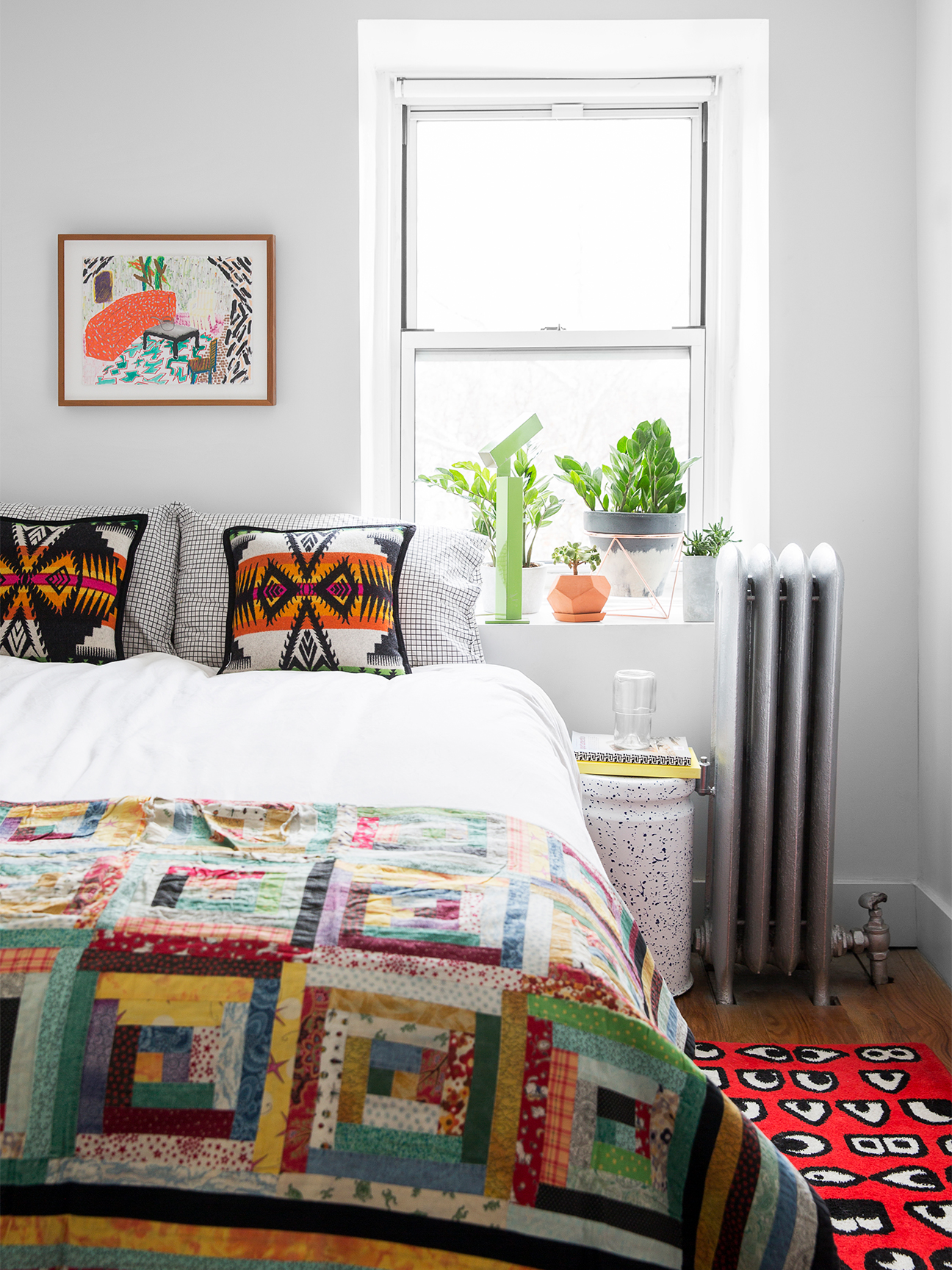 bedroom with colorful quilt