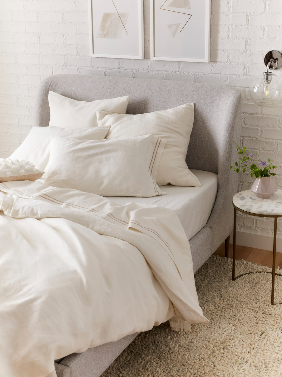 Bed with simple white bedspread