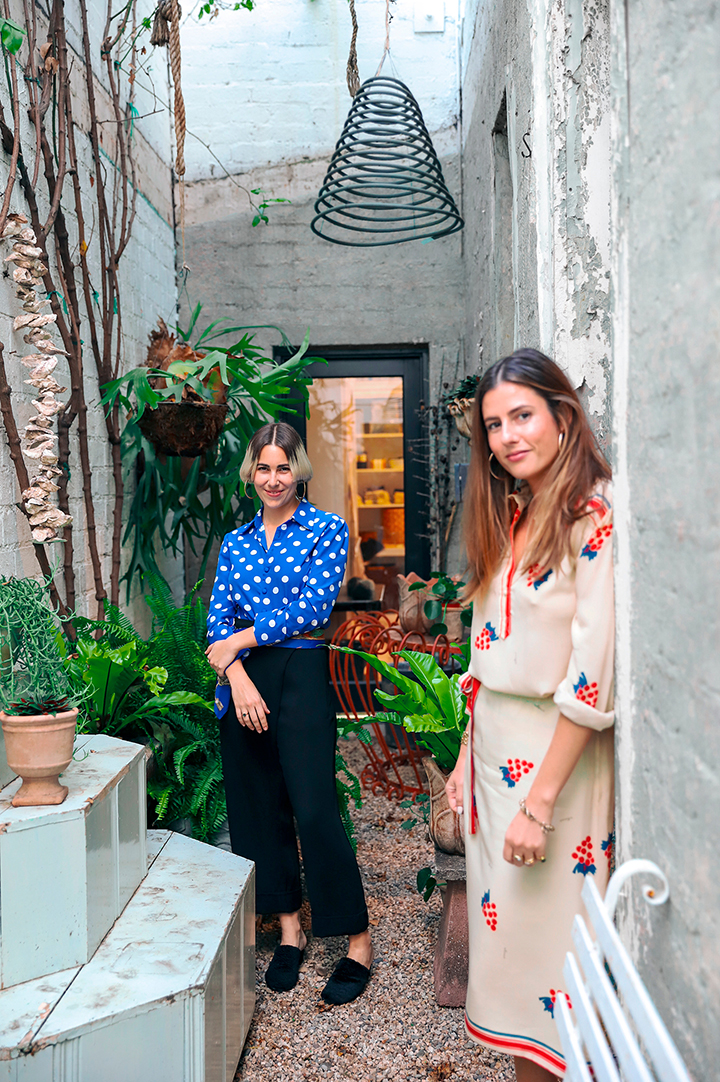 portrait of two women in doorway outside