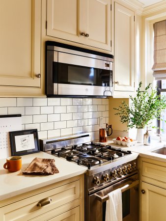 Small kitchen with yellow cabinets