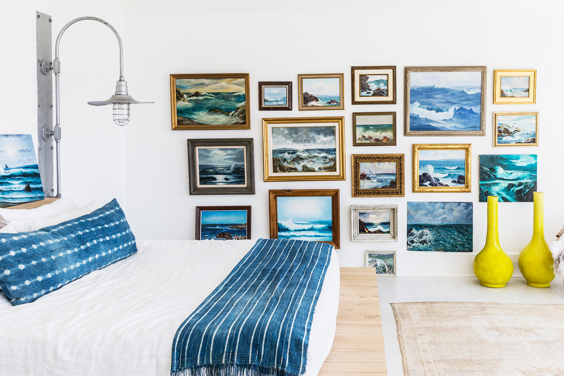 Bed with matching blue pillow and throw blanket