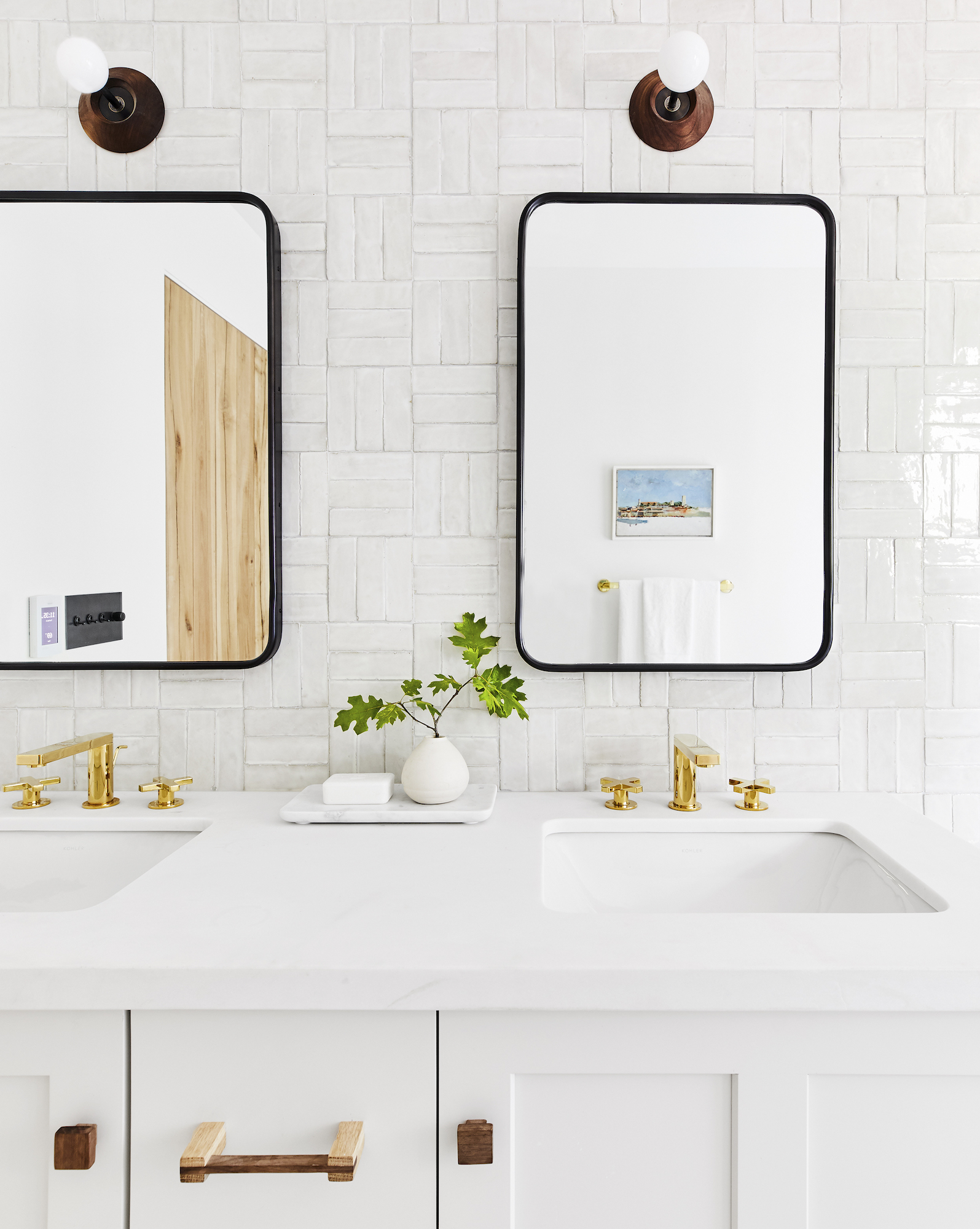 White bathroom with brass fixtures