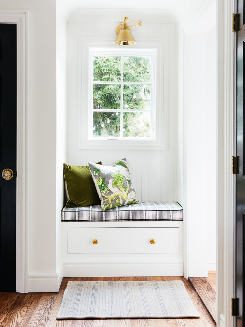 whtie beadboard walls with striped cushion