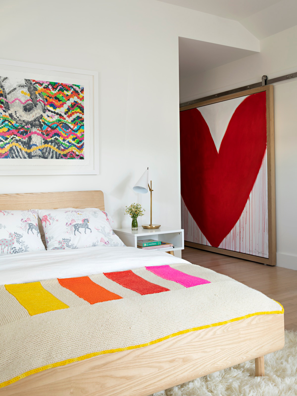 girls room with large red heart painting