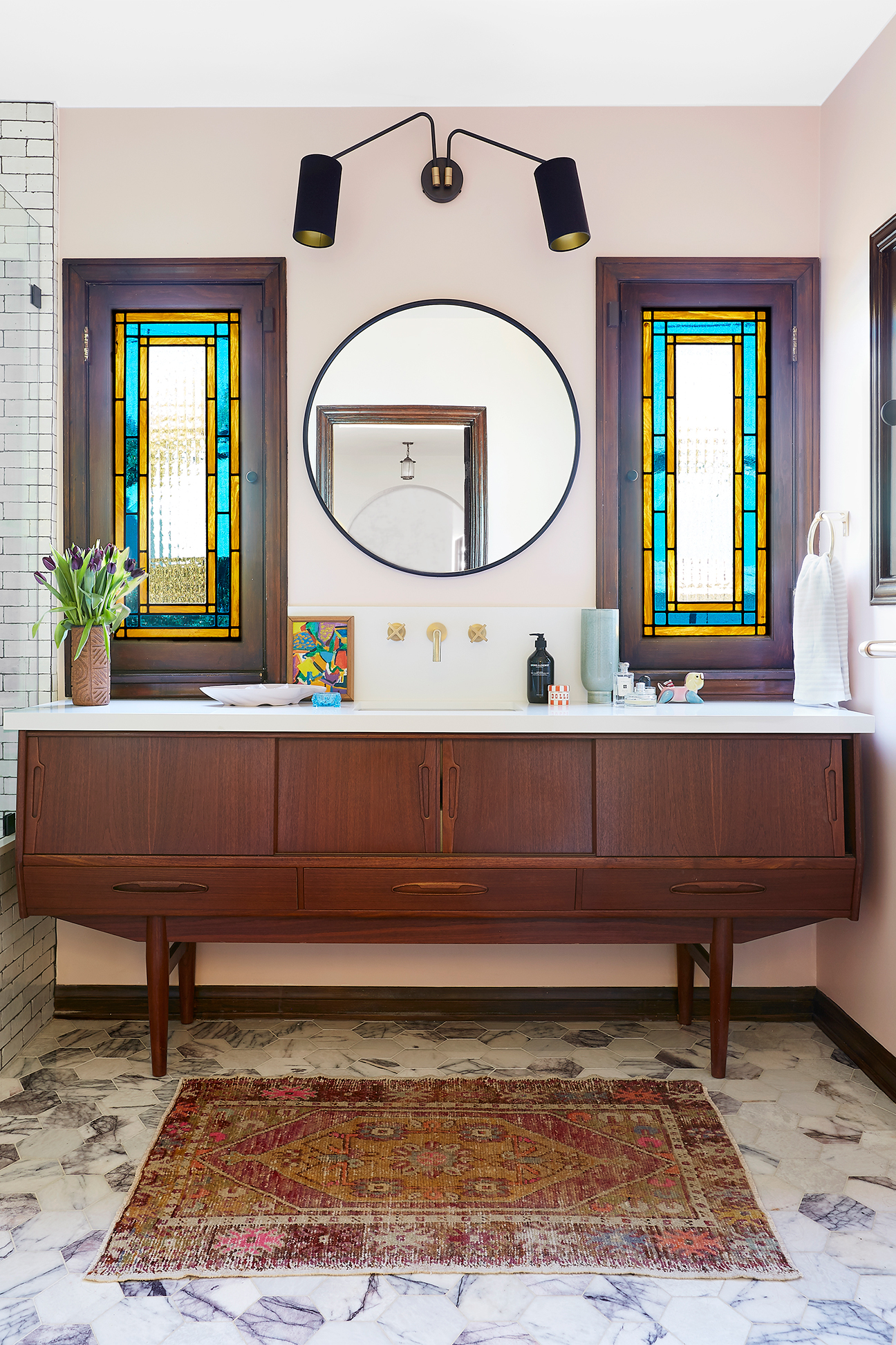 pink bathroom with stained glass windows