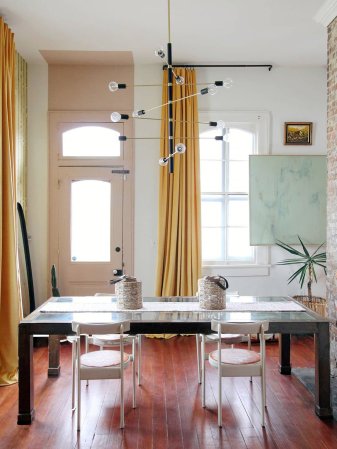 entry with dining table and pink door