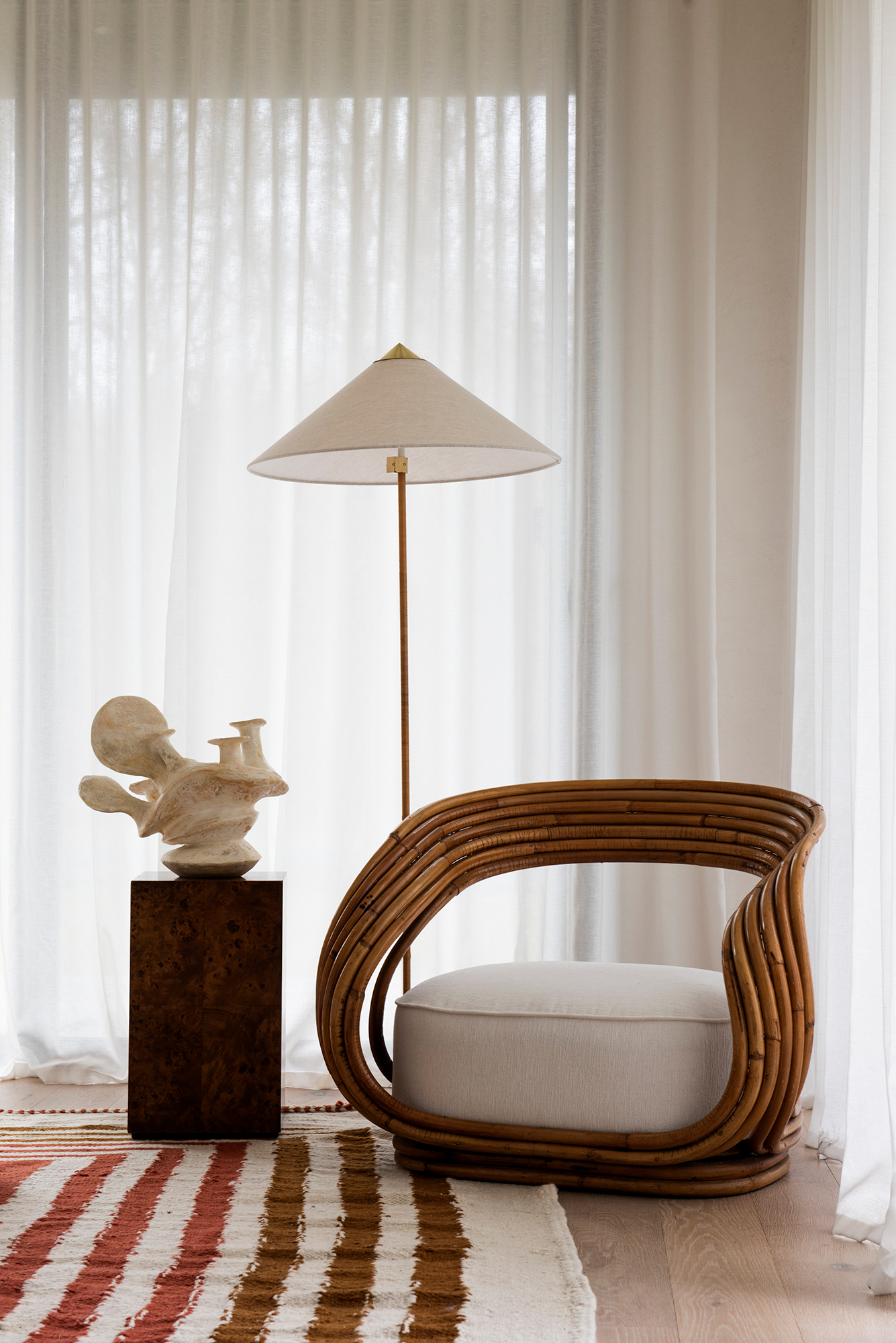 curvy rattan armchair