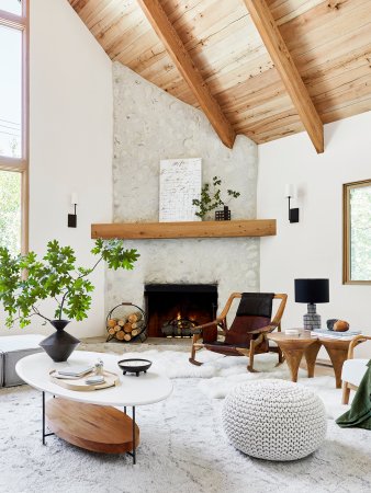 cabin living room with large beamed ceilings