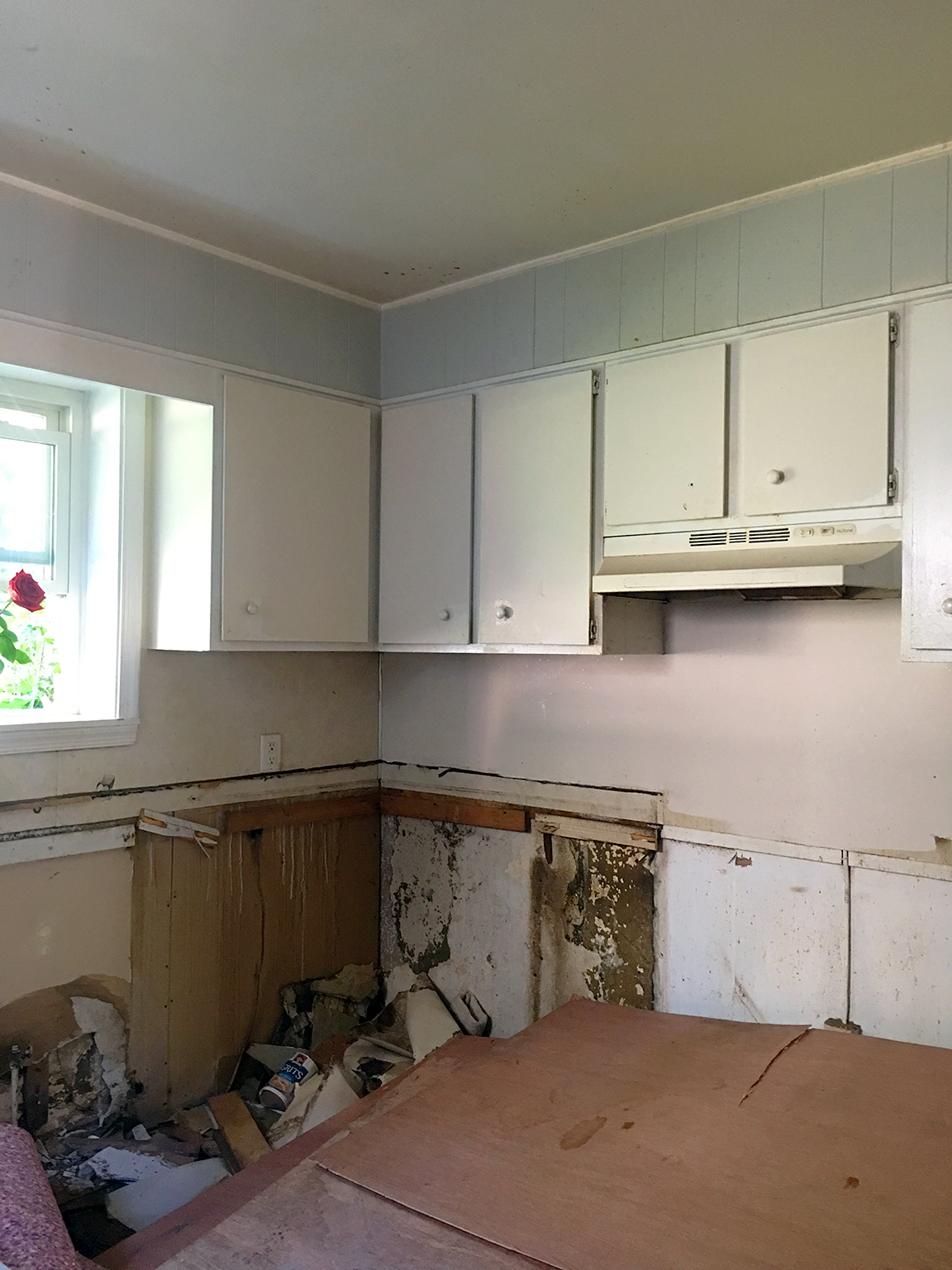 before image of half demolished kitchen