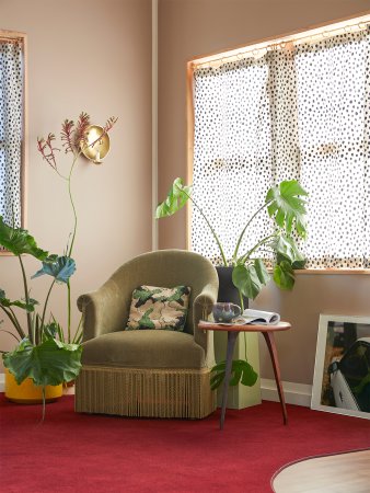 mauve living room with green armchair