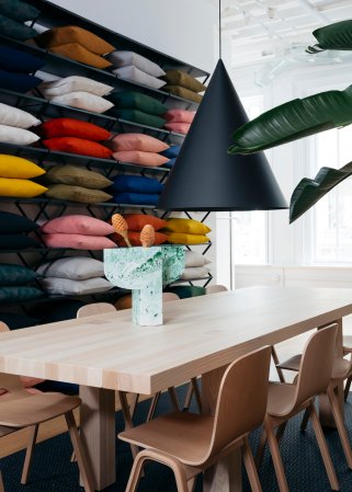 dining table with conical black pendant hanging over