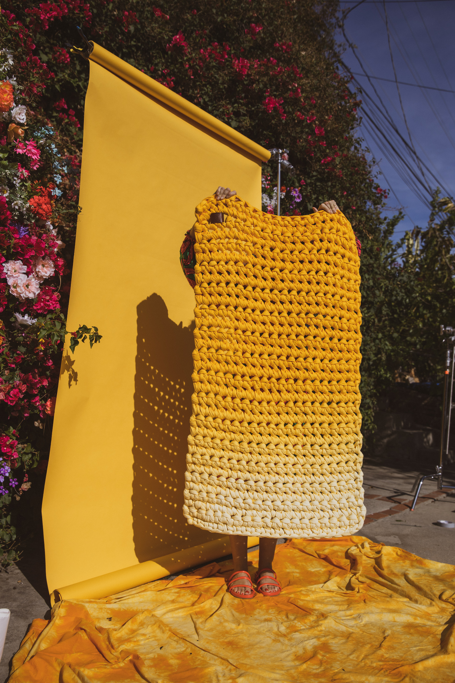 woman holding yellow blanket