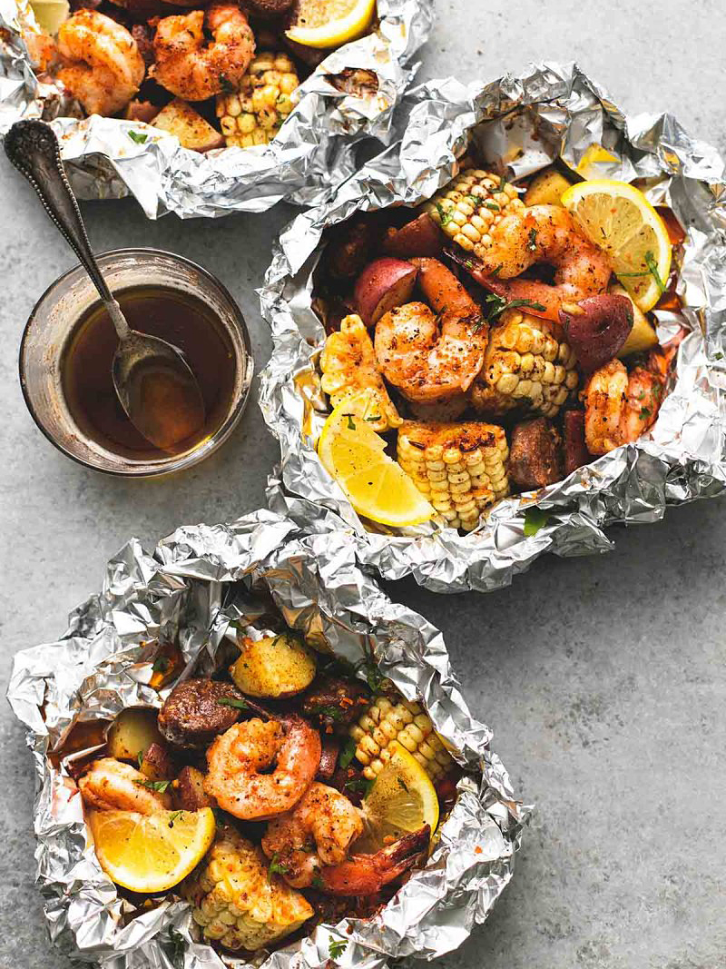 seafood bakes in aluminum with corn