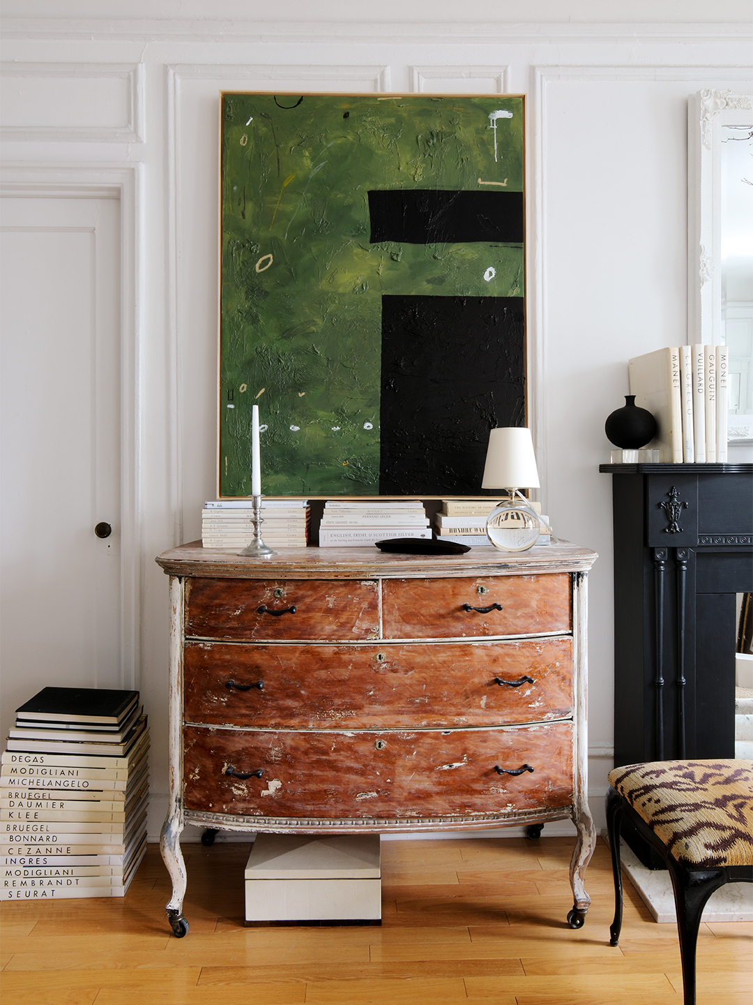 Green painting above a dresser