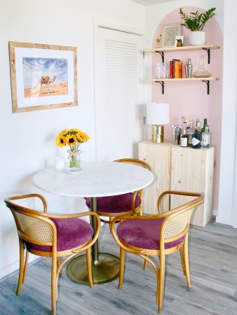 dining nook with pink arch wall mural