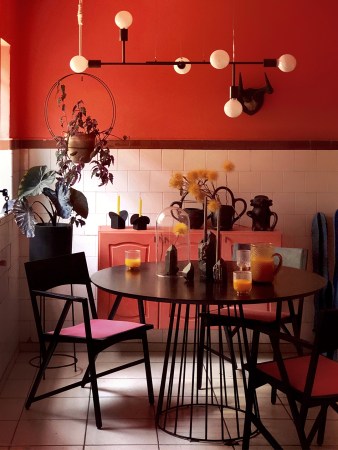 red kitchen with mid century chandelier