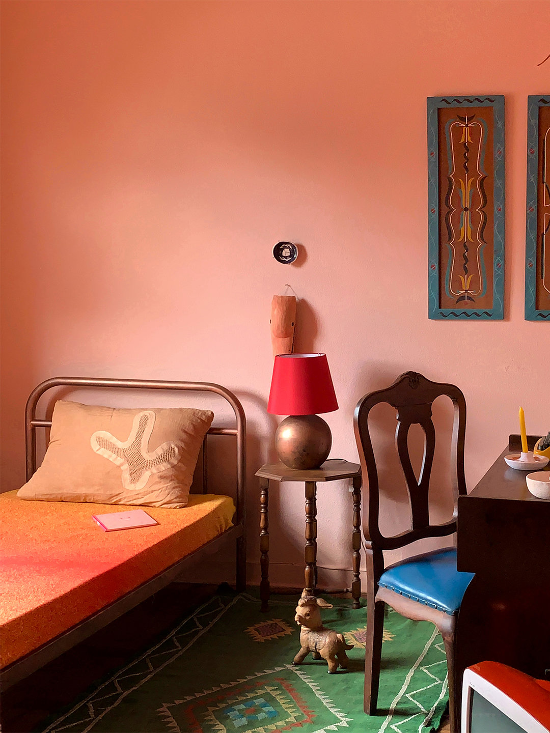 pink bedroom with dark wood furniture