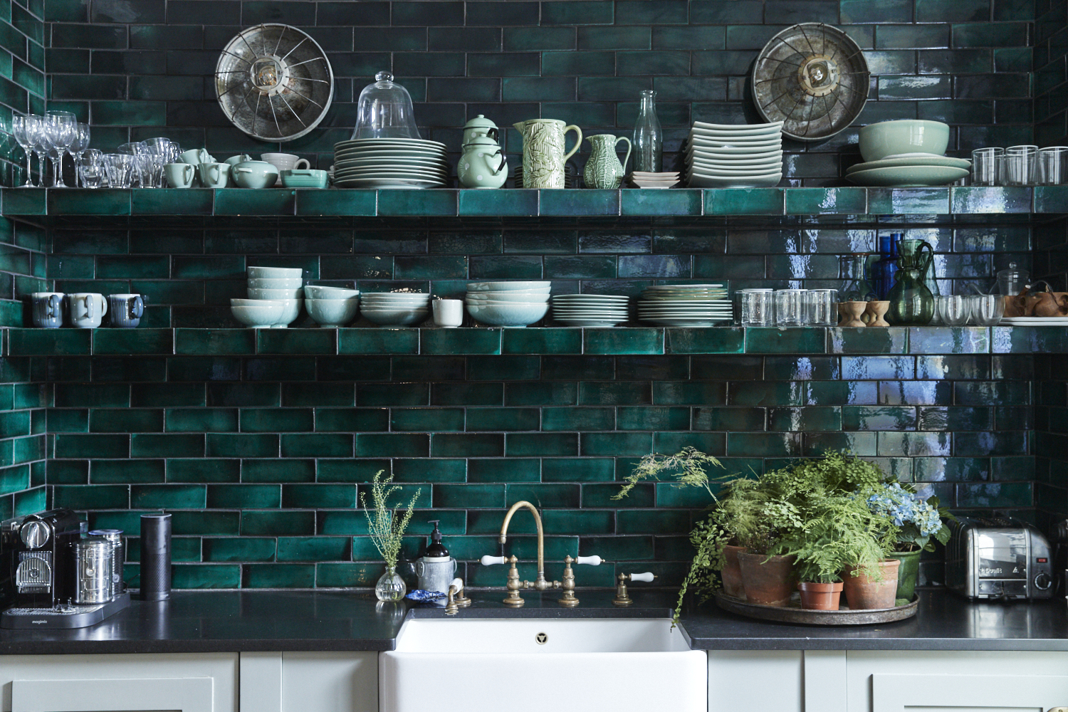 emerald green–tiled kitchen