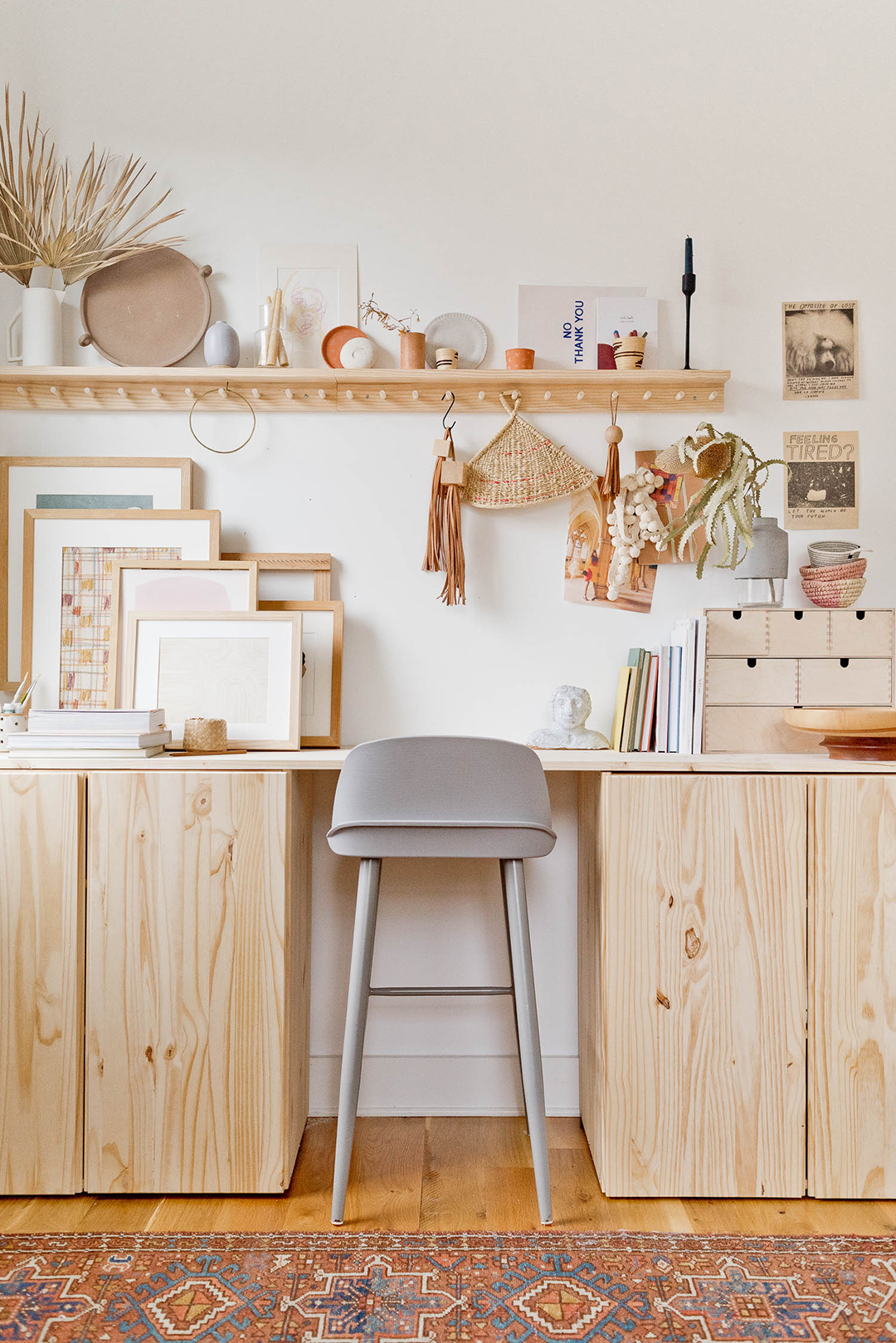 plain wood desk with tan stool