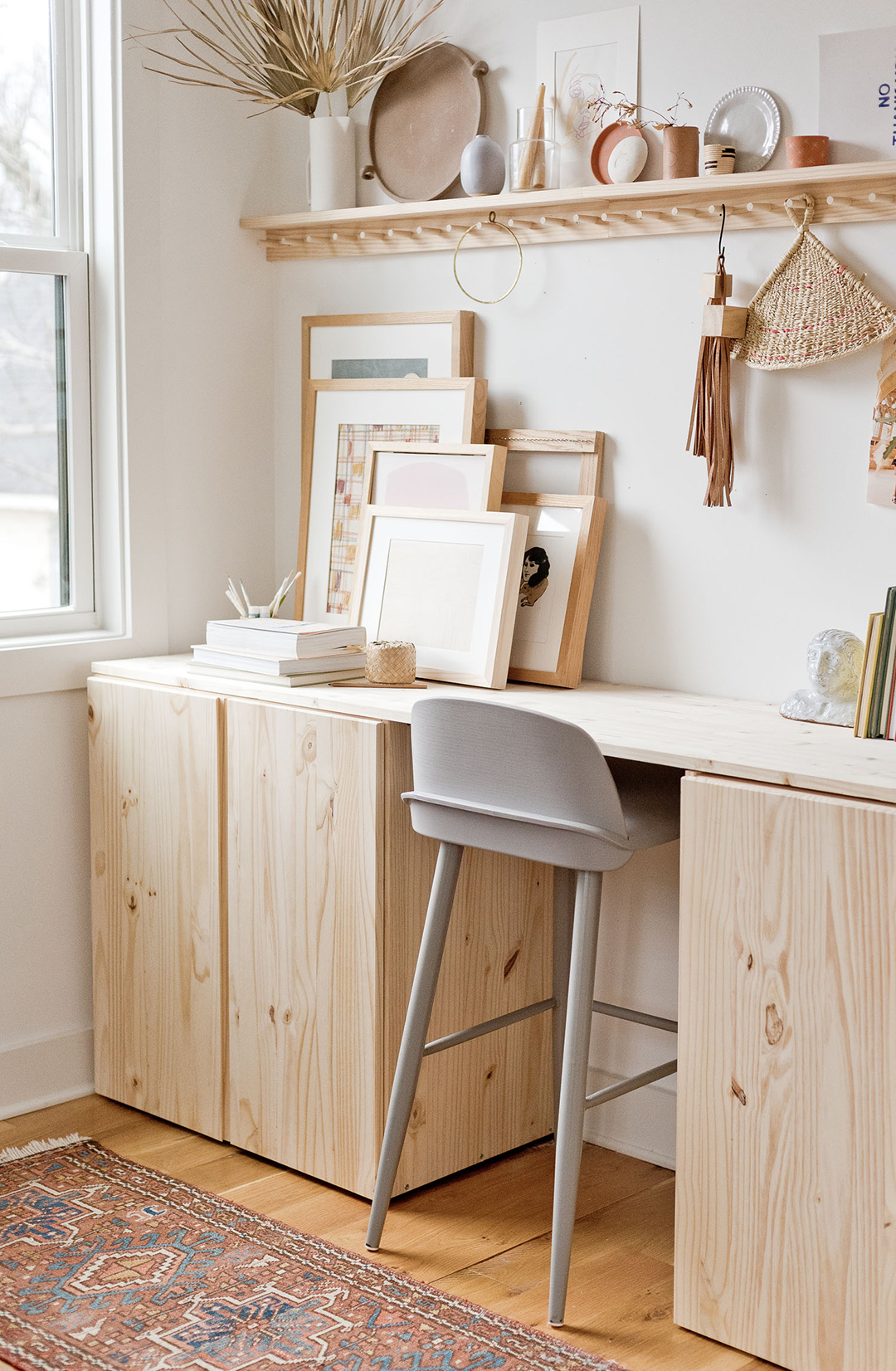 plain wood desk with tan stool