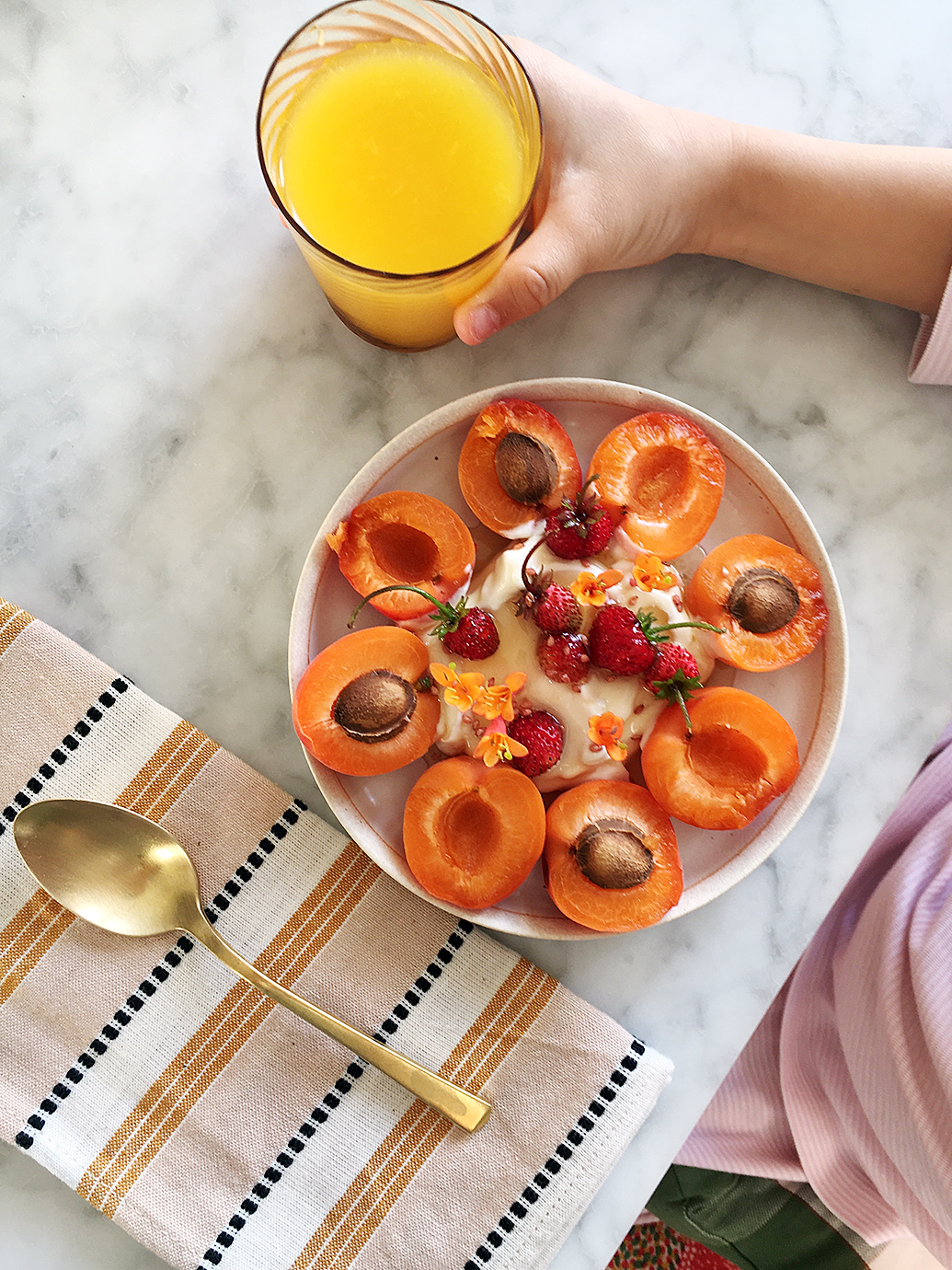 apricot on a plate with orange juice