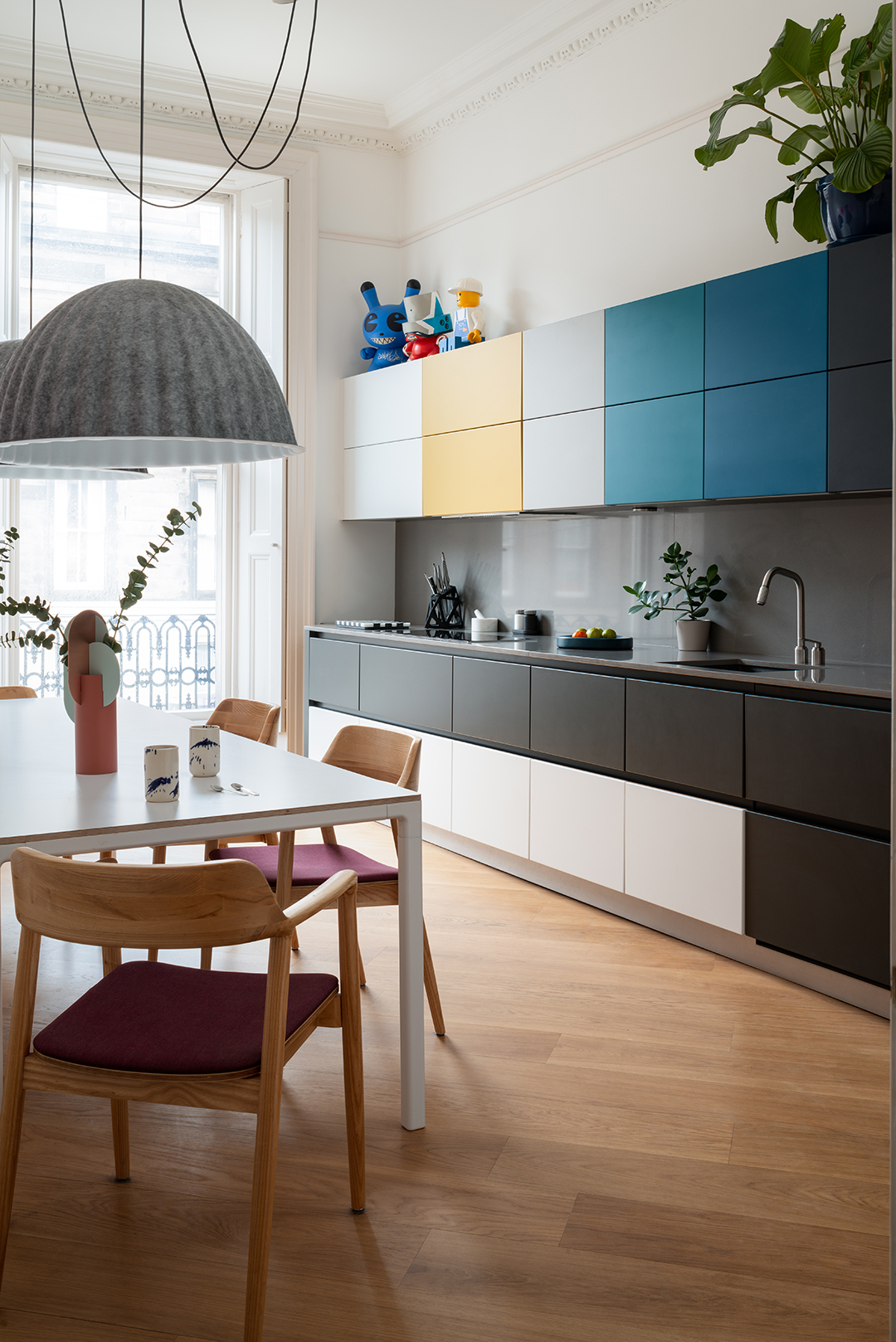 Multicolored kitchen cabinets in Sam Buckley's Edinburgh apartment