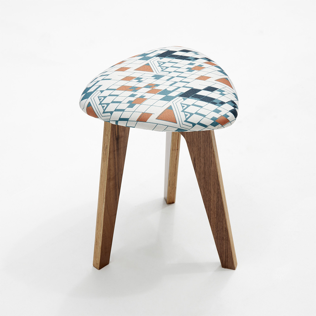 triangular stool with blue and orange triangle fabric